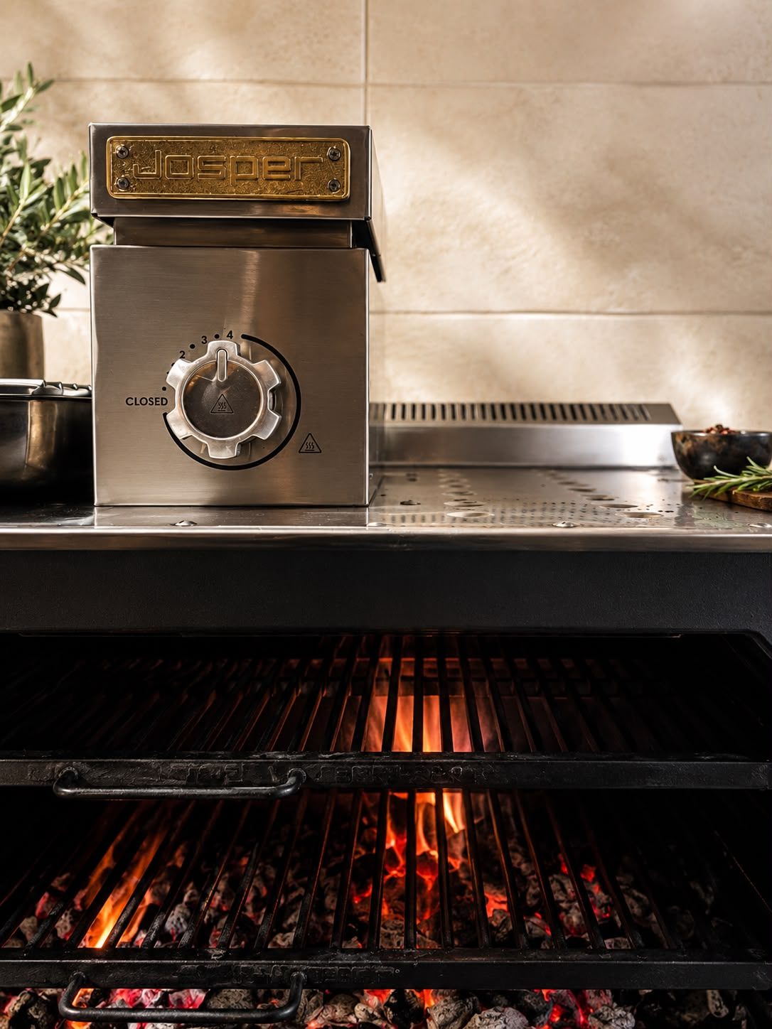 Josper oven detail, brass plate and embers — Chez Bastianin